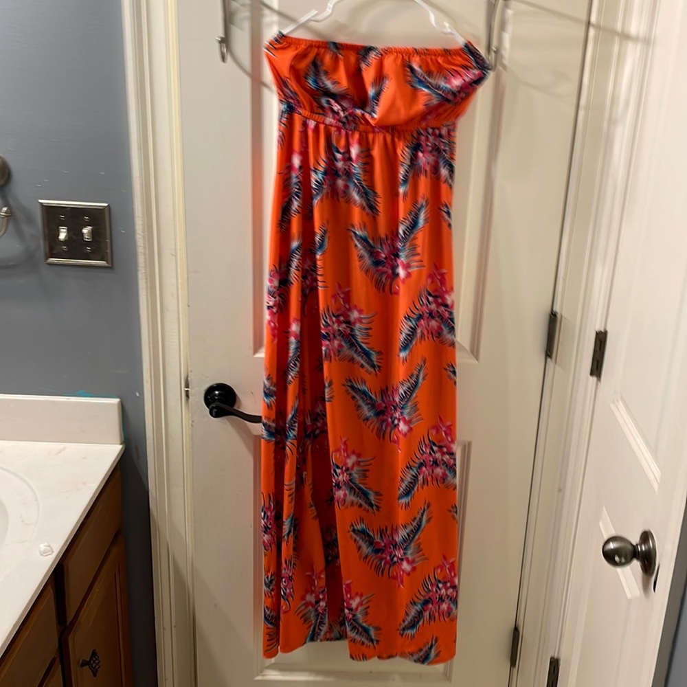 A bright orange floral dress never worn
